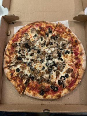 Medium Sliced sausage, mushroom and black olive pizza.