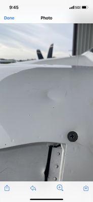 Dent on airplane engine cover