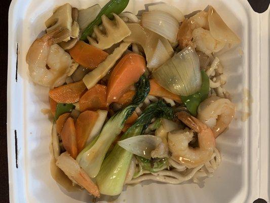 SHANGHAI - Pan fried udon noodles topped with sauteed mushrooms, baby corn, bamboo, onion, carrot, and snow peas in a brown sauce