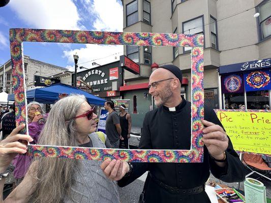 Have your picture taken with a priest