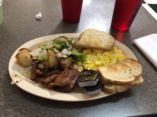 Bacon, scrambled eggs, O'Brien potatoes, sourdough toast.