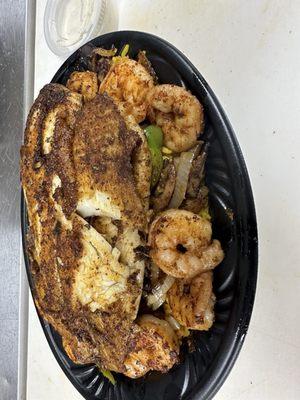 Rice bowl with black beans, bell peppers, onions, mushrooms with grilled shrimp and grilled fish added.