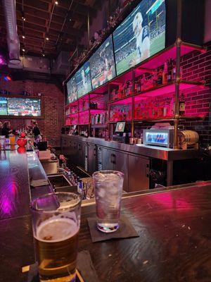 The bar with the awesome liquor selection on the wall.