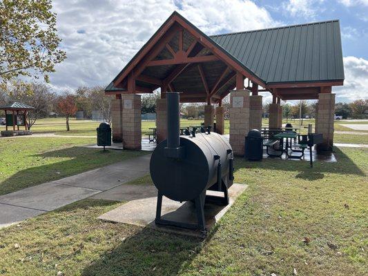 Covered picnic area with grills and a smoker