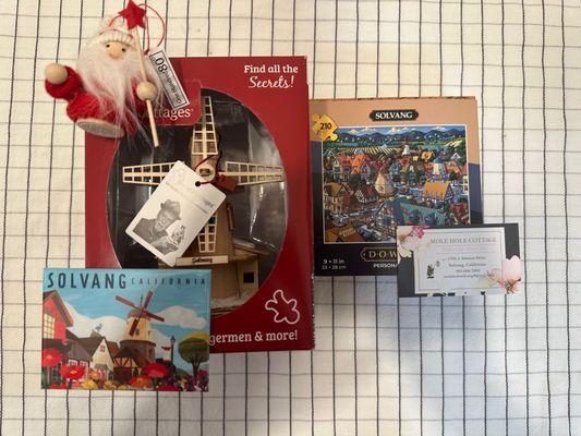 Solvang Magnet by Local Artist ($9), Little Santa Ornament ($7), Solvang Puzzle ($14), Ginger Cottages Solvang Windmill that lights up ($30)