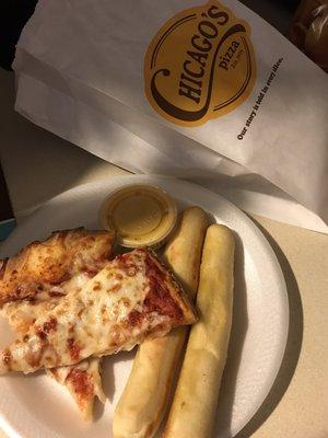 Cheese pizza, breadsticks, and nacho cheese