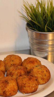 Rellenos de papa.  Deep fried mashed potato balls stuffed with ground beef.