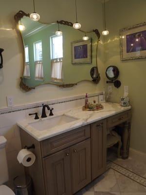 Vintage mirror with modern hanging lights and custom vanity