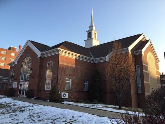 Beautiful, large red brick chapel.