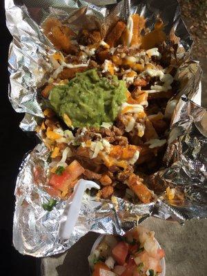 Nacho fries with carne asada . Pico on the side :)