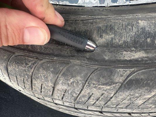 A hole in the tire so big it would have deflated a tire in less then a minute