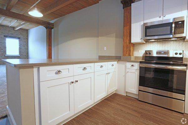 White Shaker Cabinets paired with Quartz Granite counter tops. Newly Renovated Apartment Features.