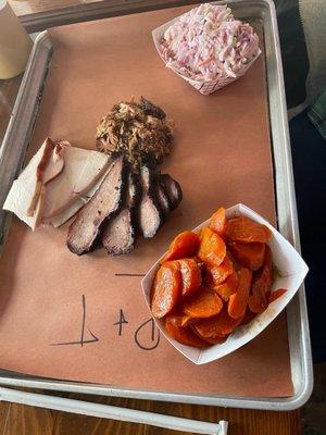 Brisket, pulled pork, turkey with glazed carrots and coleslaw