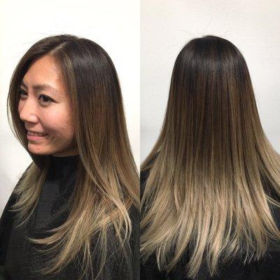 Ombré with subtle highlights to break up her dark root color & long flowing layers