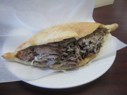 Beef shawarma on an Iraqi samoon with lettuce, tomatoes, onions, cucumbers ($3.50 plus tax)