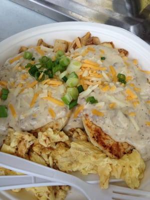 Biscuits and gravy with hashbrowns and eggs.