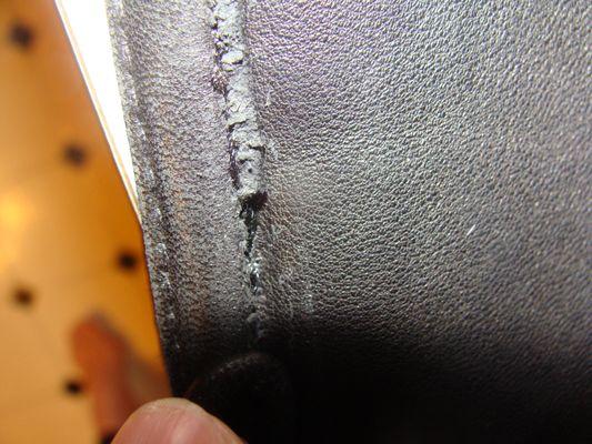 Outside of the coat damaged leather due to repair