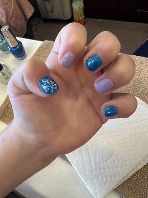 Another daughter's painted nails after basic manicure. My daughter picked all of the colors and snowflake.