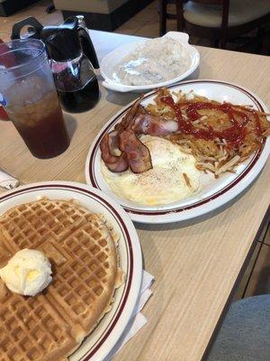 MVP breakfast-waffle, eggs, bacon, hash browns, and biscuits and gravy.