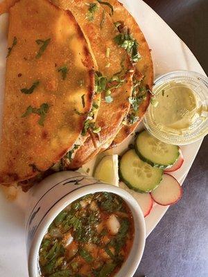 Birria, with consume, AMAZING spicy green sauce.