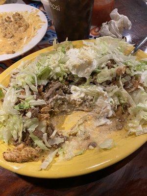 Fajita potato with steak and grilled chicken