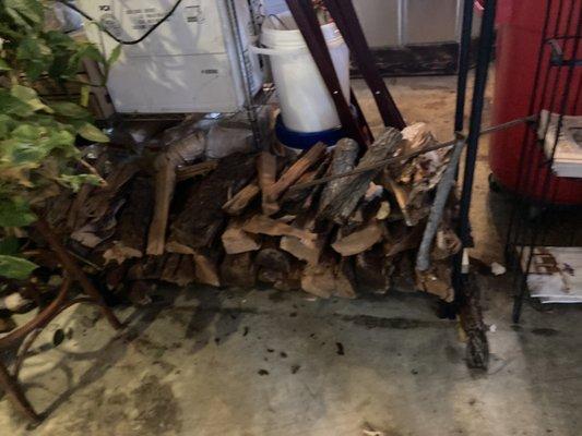 Wood pile inside the restaurant for smoking the meat