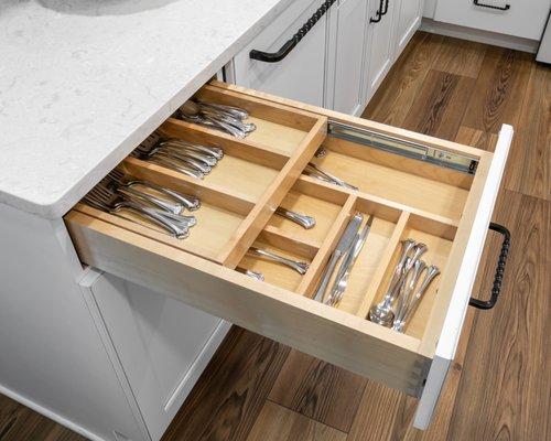 Silverware drawer and below that is the trash & recycling pullout.  PC: Renee Alexander