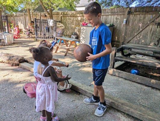 Multi-age classrooms create opportunities for our elders to teach the youngest children.