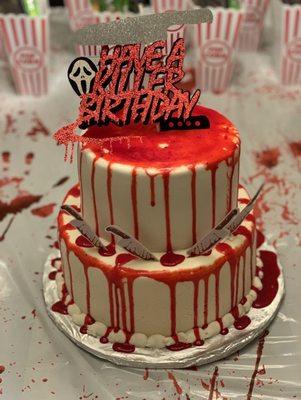 "Scream" themed birthday cake with delicious vanilla cake top layer and red velvet cake second layer.