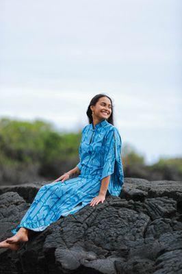 A stunning dress featuring kimono-style sleeves paired with vibrant Hawaiian prints.