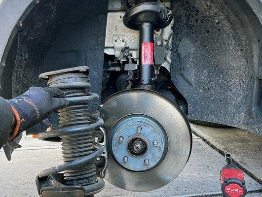 2013 Ford Escape front strut assembly installation.