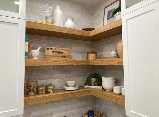 Custom stained floating shelves in the kitchen