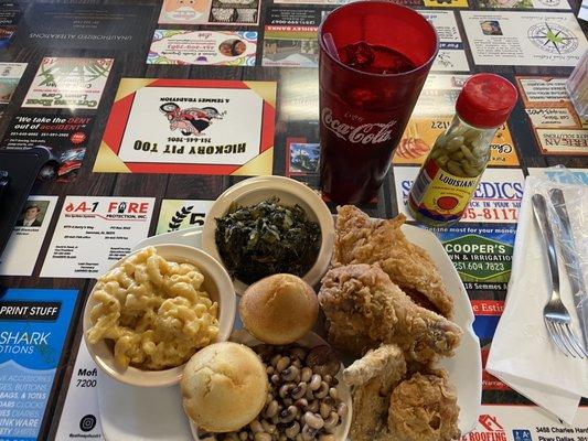 Three piece fried chicken, corn bread, homemade Mac n cheese, black eyed peas, and turnip greens.