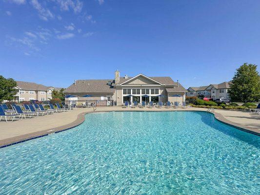 Heated outdoor pool with cascading waterfall and gazebo