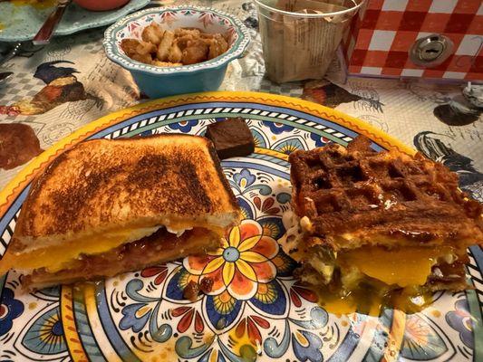 Honey butter grilled cheese and jalapeño popper with side of potatoes and a delicious piece of chocolate for after the meal.