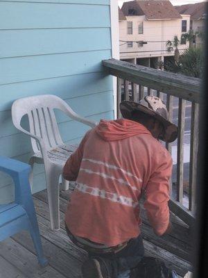 Guy on our balcony, invading our privacy and blowing debris onto our lower balcony as we were sitting outside.