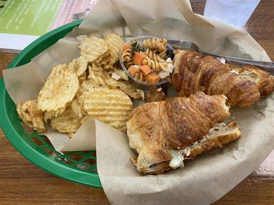 Chicken salad croissant, pasta salad and chips