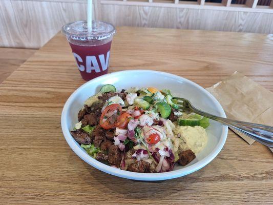 Steak + harissa bowl with lemon herb tahini dressing with blueberry lavender juice