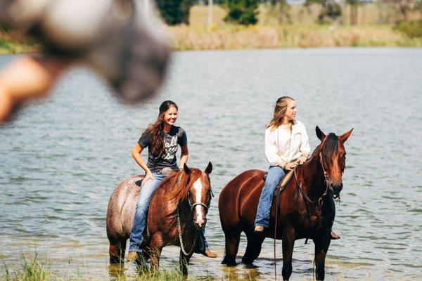 Two horse riders standing in Baldwin Lake