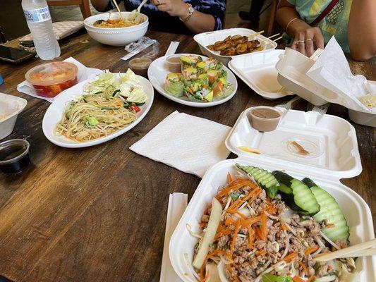 Avocado Rolls, Papaya Salad, Chicken Satay, Laksa Noodles, Chicken Larb and Sticky rice.