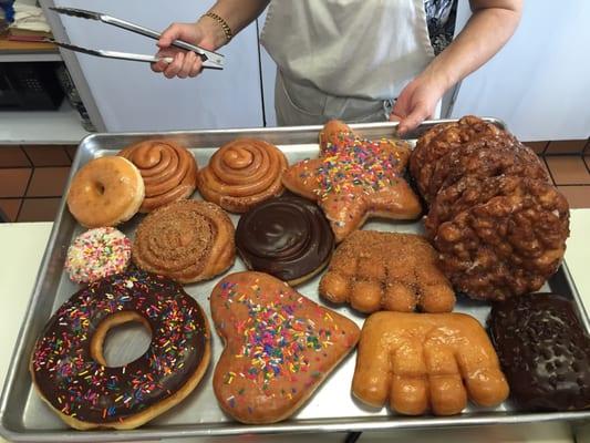 Giant donut next to regular cake donut