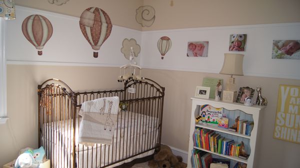 Gender neutral nursery put together for amazing clients. Vinyl balloon decals put on the wall . Benjamin Moore Muslin paint color.