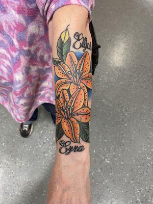 Orange lily  tattoo.