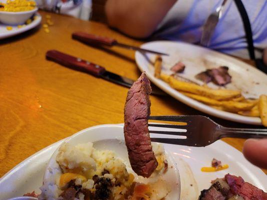 Perfectly cooked prime rib .