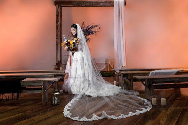 Bride under arch in Studio B