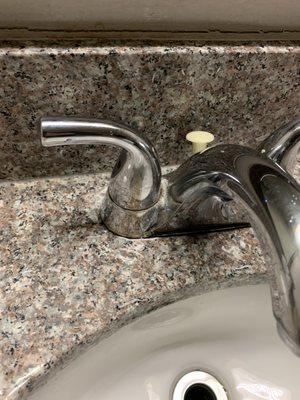 mold on the sink knobs