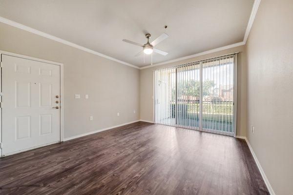 Living room area at Riverhill Apartments in Grand Prairie, Texas