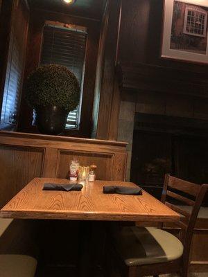 Wood paneling and fireplace in a dining area