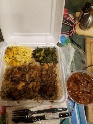 Oxtails with rice, collards and mac and an extra side of sweet potatoes.