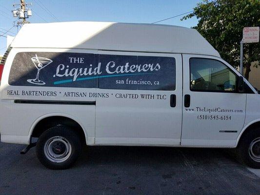 White passenger van with lift gate. We use for our beverage catering company in SF. Drink with us! TheLiquidCaterers.com